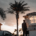 A real estate litigation attorney stands before a residential home, ready to handle a dispute.
