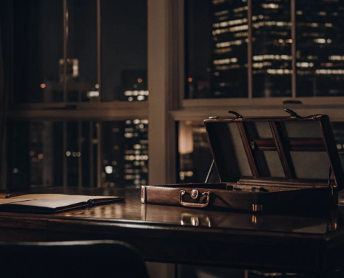 Briefcase and legal documents on a desk in a business litigation attorney's office.