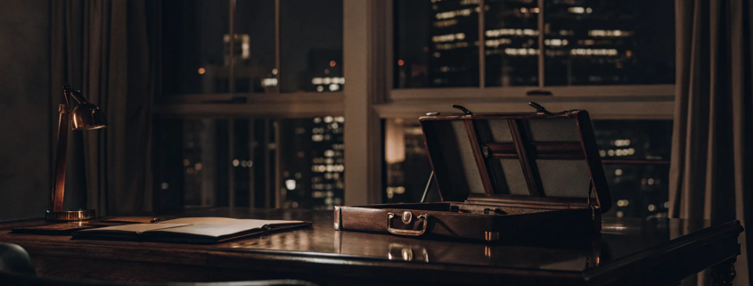 Briefcase and legal documents on a desk in a business litigation attorney's office.