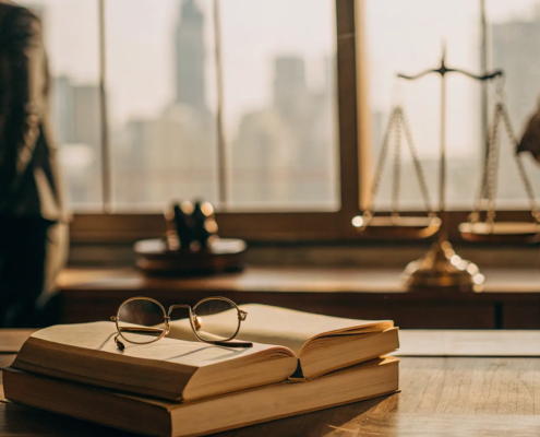 Partnership breakup attorney at a desk with scales of justice, discussing legal options.