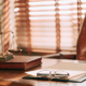 Small business lawyer's desk with scales of justice and legal documents.