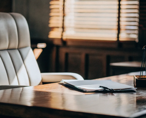 Civil suit lawyer's desk with documents prepared for a free consultation.