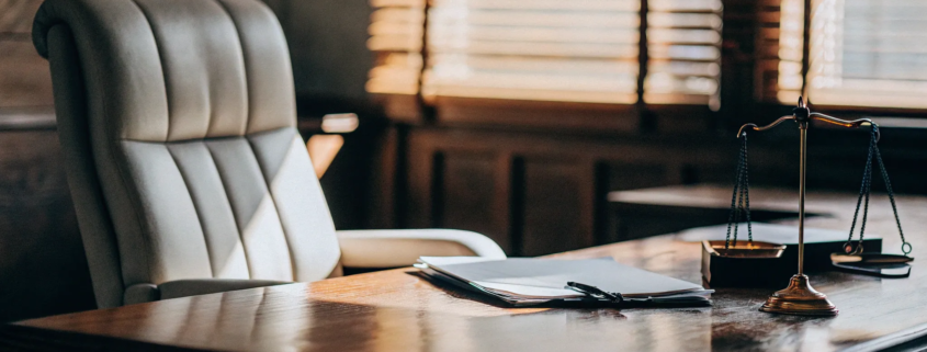 Civil suit lawyer's desk with documents prepared for a free consultation.