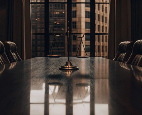 A lawyer's conference room with scales of justice for a business partnership dissolution.