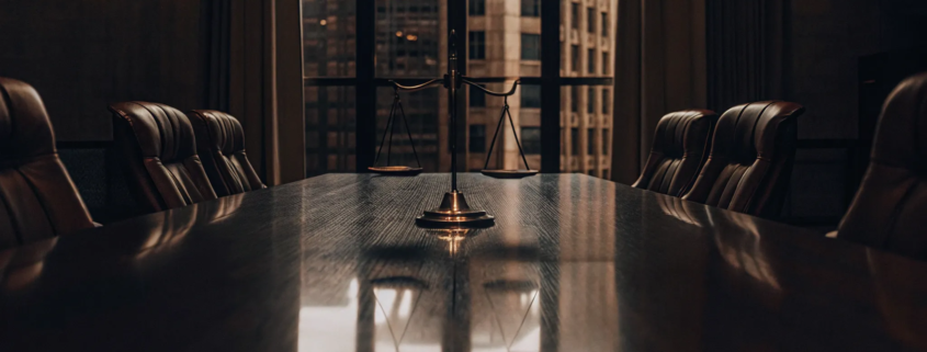 A lawyer's conference room with scales of justice for a business partnership dissolution.