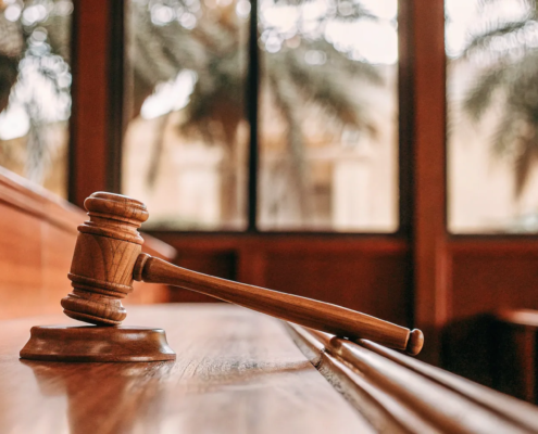 A judge's gavel on a bench, setting the deadline for how long you have to contest a will in Florida.