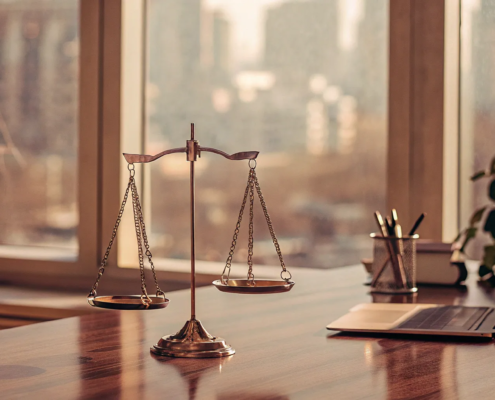 Scales of justice on a desk at the best corporate fraud law firm.