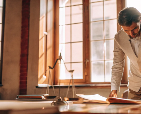 Foreclosure attorney analyzing legal documents to help a homeowner.