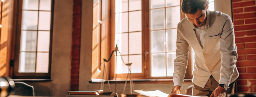 Foreclosure attorney analyzing legal documents to help a homeowner.