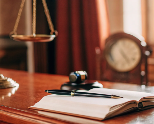 Gavel, law book, and scales of justice explaining civil lawyer fees.