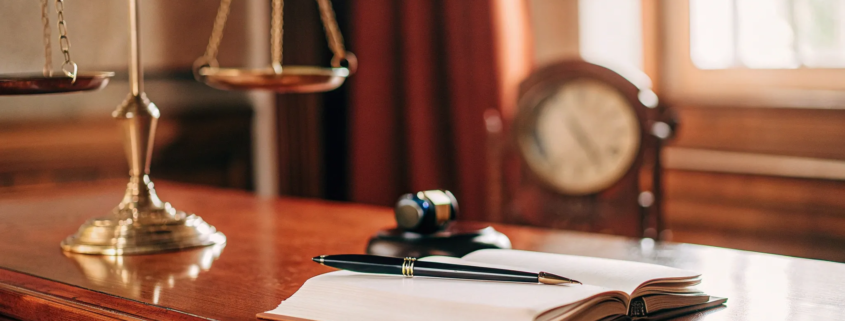 Gavel, law book, and scales of justice explaining civil lawyer fees.