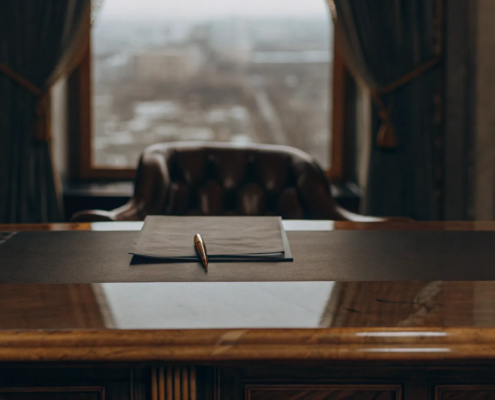 A pen on a contract highlights the cost of a real estate attorney for closing.