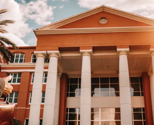 A real estate attorney walks to a closing, a key time to hire legal help for a property deal.