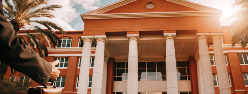 A real estate attorney walks to a closing, a key time to hire legal help for a property deal.