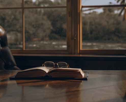 A law book and scales of justice on a desk explaining why you would need a probate attorney.