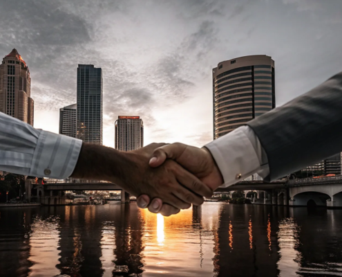 A Tampa business breakup attorney helps partners finalize their dissolution with a handshake.