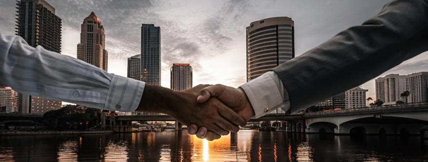 A Tampa business breakup attorney helps partners finalize their dissolution with a handshake.