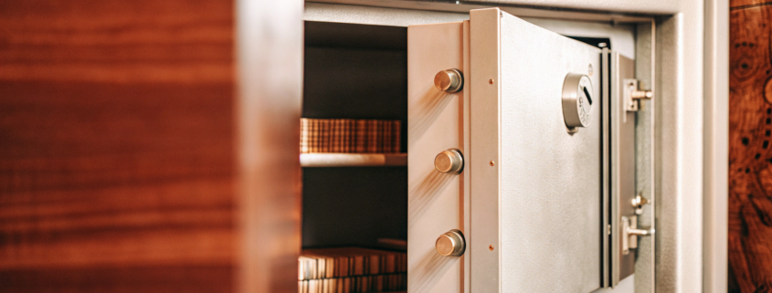 A trade secret litigation attorney keeps business assets and documents secure in a safe.