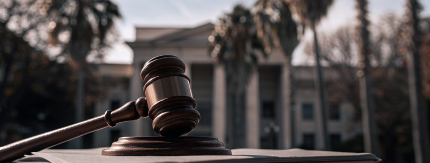 Gavel on legal documents showing how long a quiet title action takes in Florida.