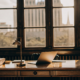 Lawyer's desk with legal books and a laptop for determining the cost of a quiet title action.