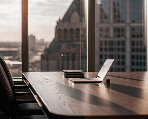 Legal documents for the nationwide real estate commission settlement on a conference room table.