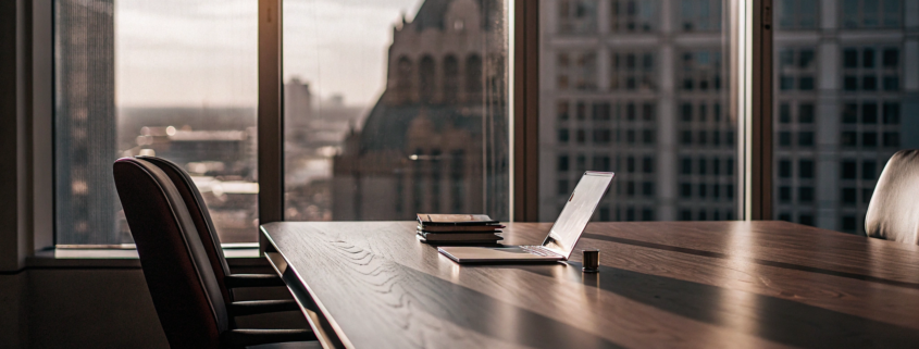 Legal documents for the nationwide real estate commission settlement on a conference room table.
