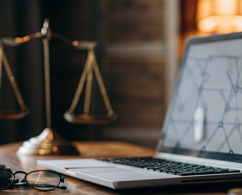 A business tort litigation attorney's desk with a gavel and scales of justice.