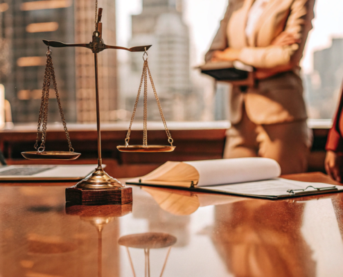 A commercial real estate litigation attorney reviews a case with legal documents and scales of justice.