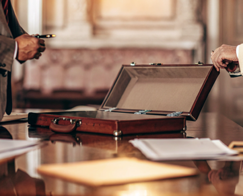 An attorney reviews a non-compete agreement for enforcement with a client.