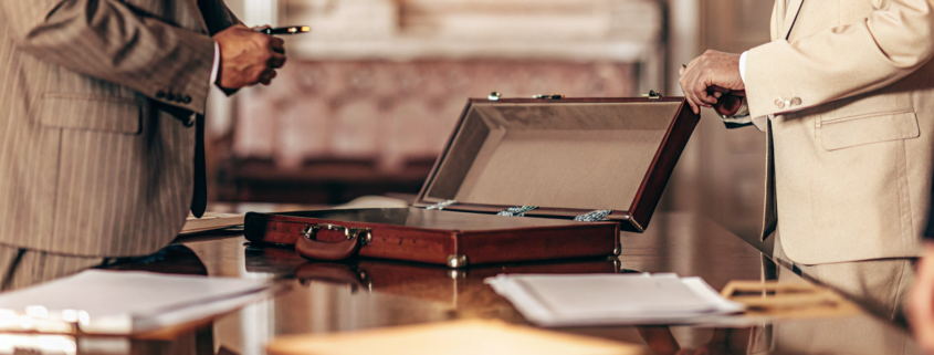 An attorney reviews a non-compete agreement for enforcement with a client.