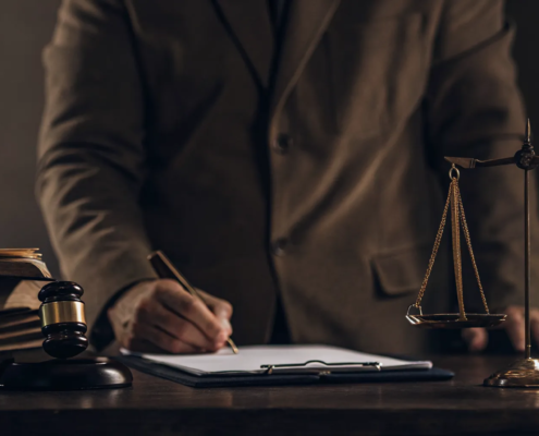 A lawyer prepares a response to a quiet title action with legal documents, a gavel, and scales of justice.