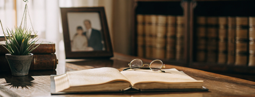 A last will and testament on a desk, a key part of choosing between a will and a trust.